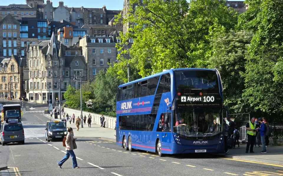 Blue Airlink 100 bus on an Edinburgh street