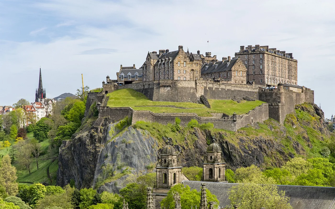 Edinburgh Castle rising above the grassy slopes of Castle Rock