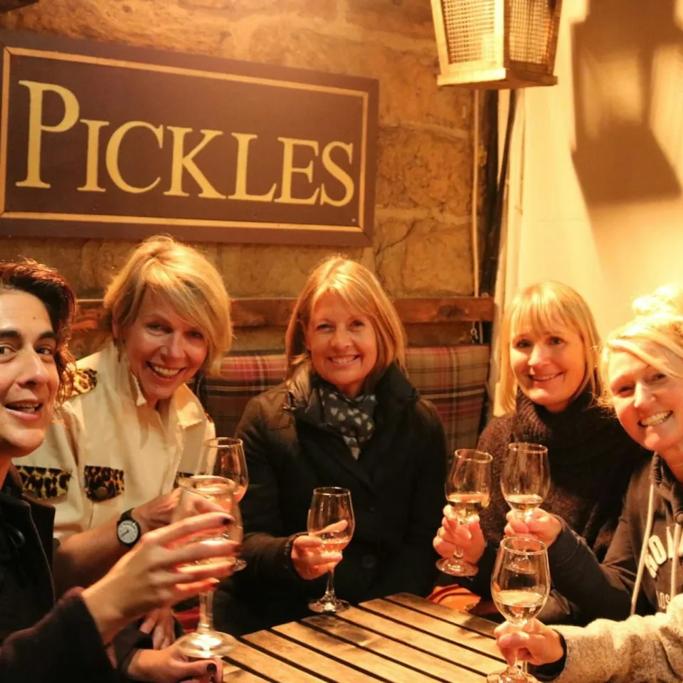 Small group enjoying drinks during a guided food experience