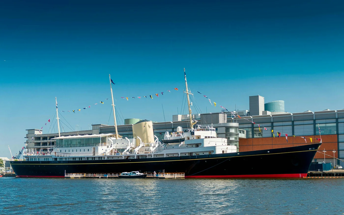 The Royal Yacht Britannia moored beside the Leith visitor buildings