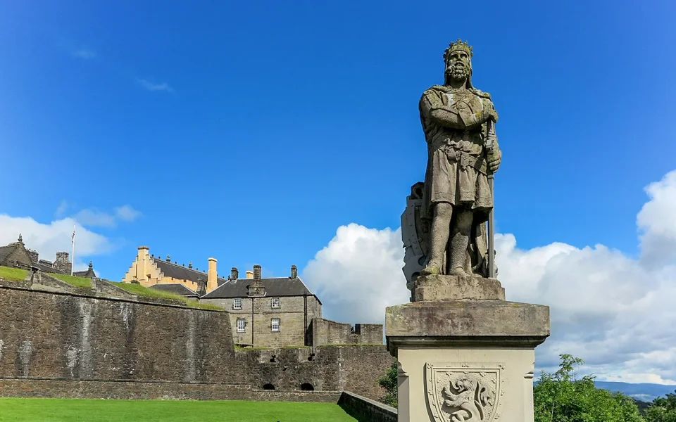 Historic statue beside Stirling Castle’s stone walls